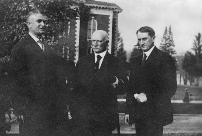 Black and white photo of three men.