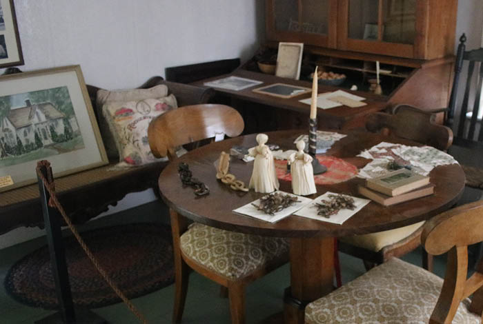 Table with historical artifacts and books.
