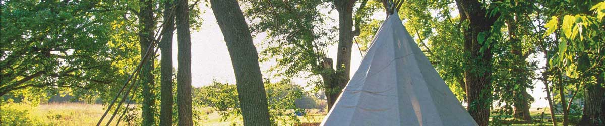 Lower Sioux Agency community tipi in morning sunlight.