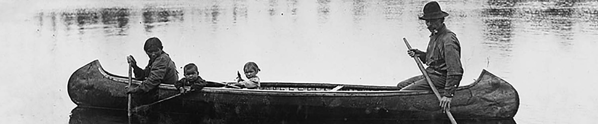 Unidentified Ojibwe family in canoe at Vermilion Lake, about 1905.
