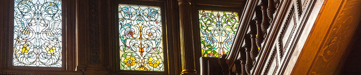 Three of the stained glass windows and part of the grand staircase