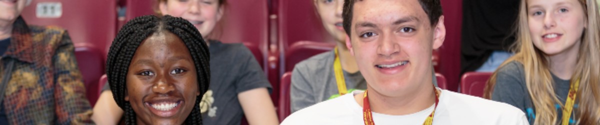 Two students smiling.