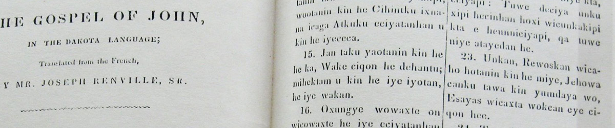 An open book titled The Gospel of John, in the Dakota Language.