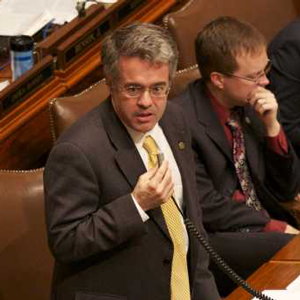 Color image of Minnesota Representative Terry Morrow (DFL) speaking on the House floor against SF 1308, 2011.
