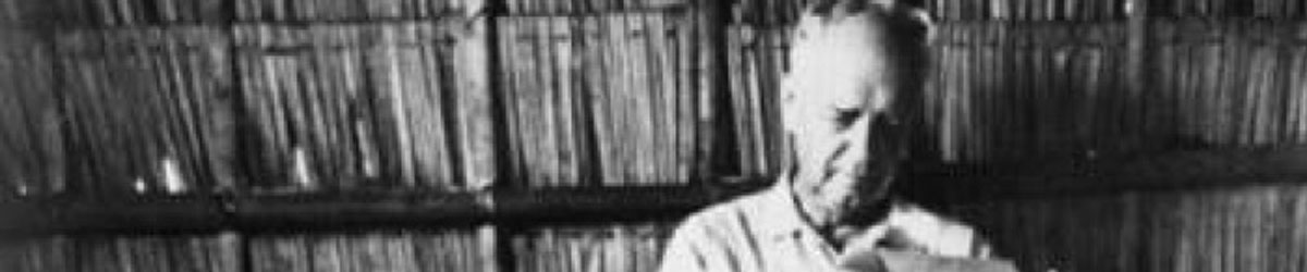 Charles Lindbergh writing in a hut in the Philippines, 1970. 