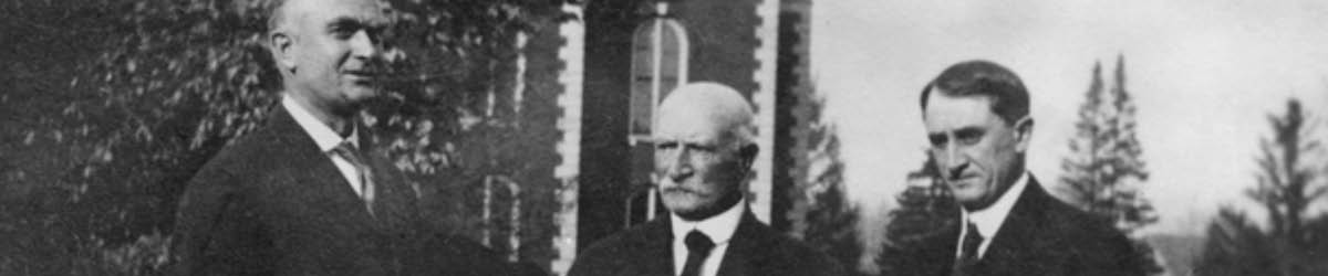 W. W. Mayo stands with his two sons.