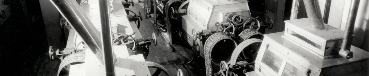 Large belts and machinery used in flour milling.