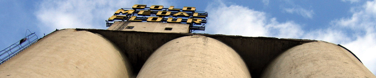 Looking up towards the large concrete grain silos.