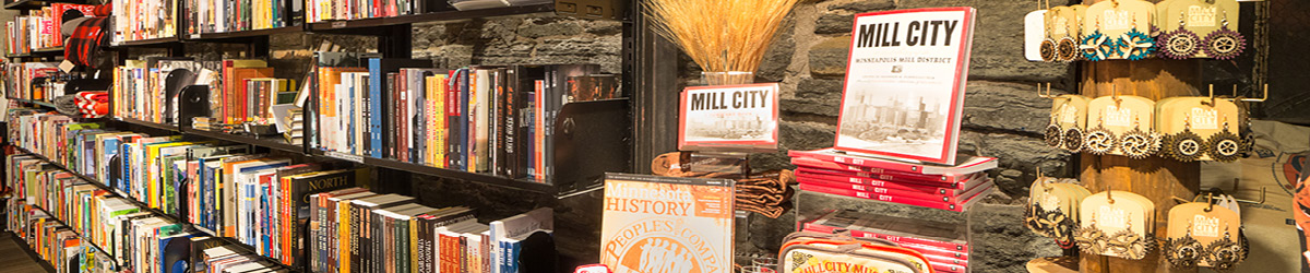 A long shelf with books available for purchase at the Mill City Museum gift shop.