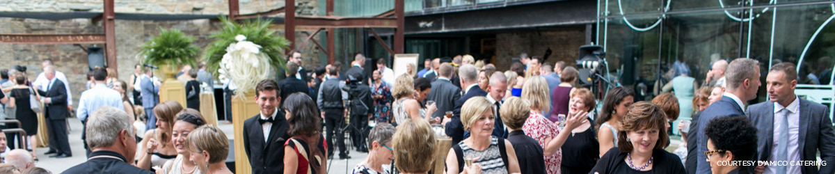 Formal gathering of people in the ruin courtyard.