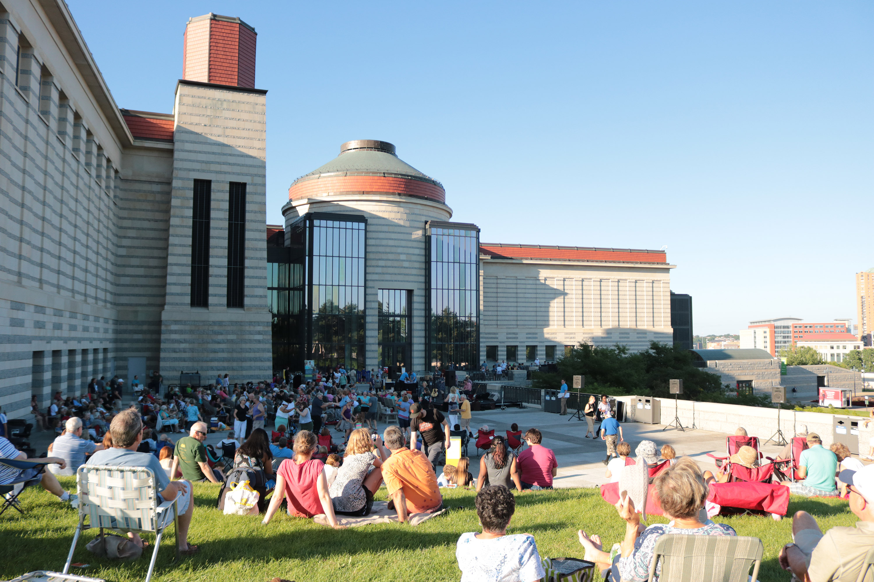 image of people on the lawn enjoying a concert