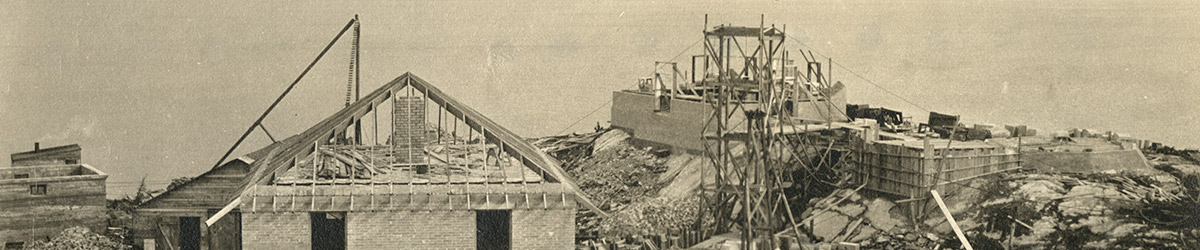 Frame of the lighthouse and two buildings under construction