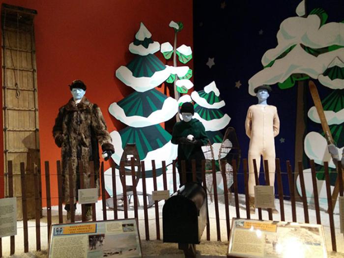 A display of mannequins with winter attire typical of Minnesota winters.