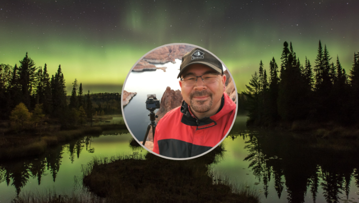 Image of photographer Travis Novitsky against a photograph of the northern lights.