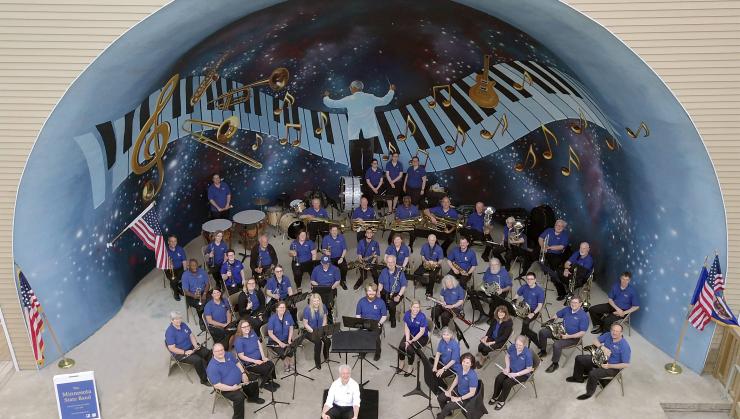 Minnesota State Band seated in amphitheater, shown from above
